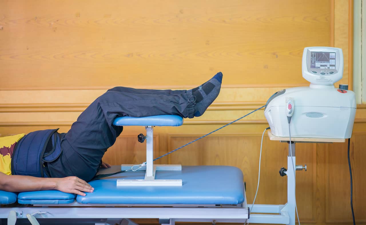 SPINAL TRACTION OR SPINAL DECOMPRESSION